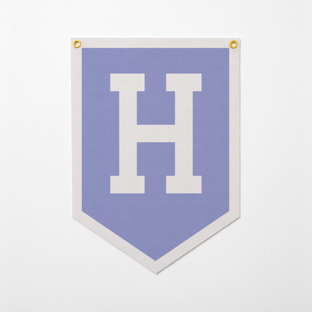 A banner with a large white letter &amp;quot;H&amp;quot; on a light blue background.