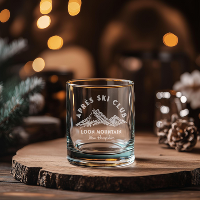 a glass cup sitting on top of a wooden table