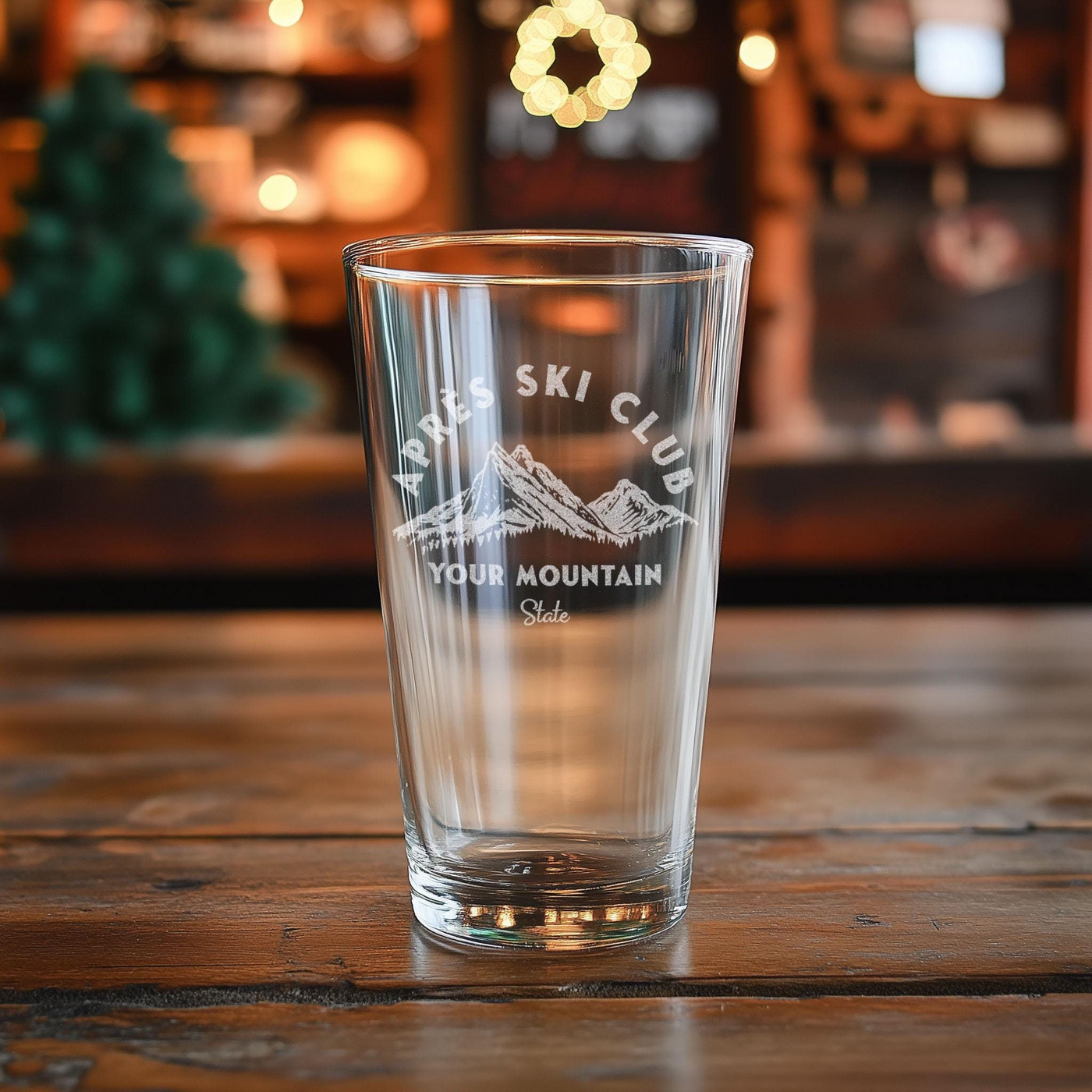 a clear glass sitting on top of a wooden table