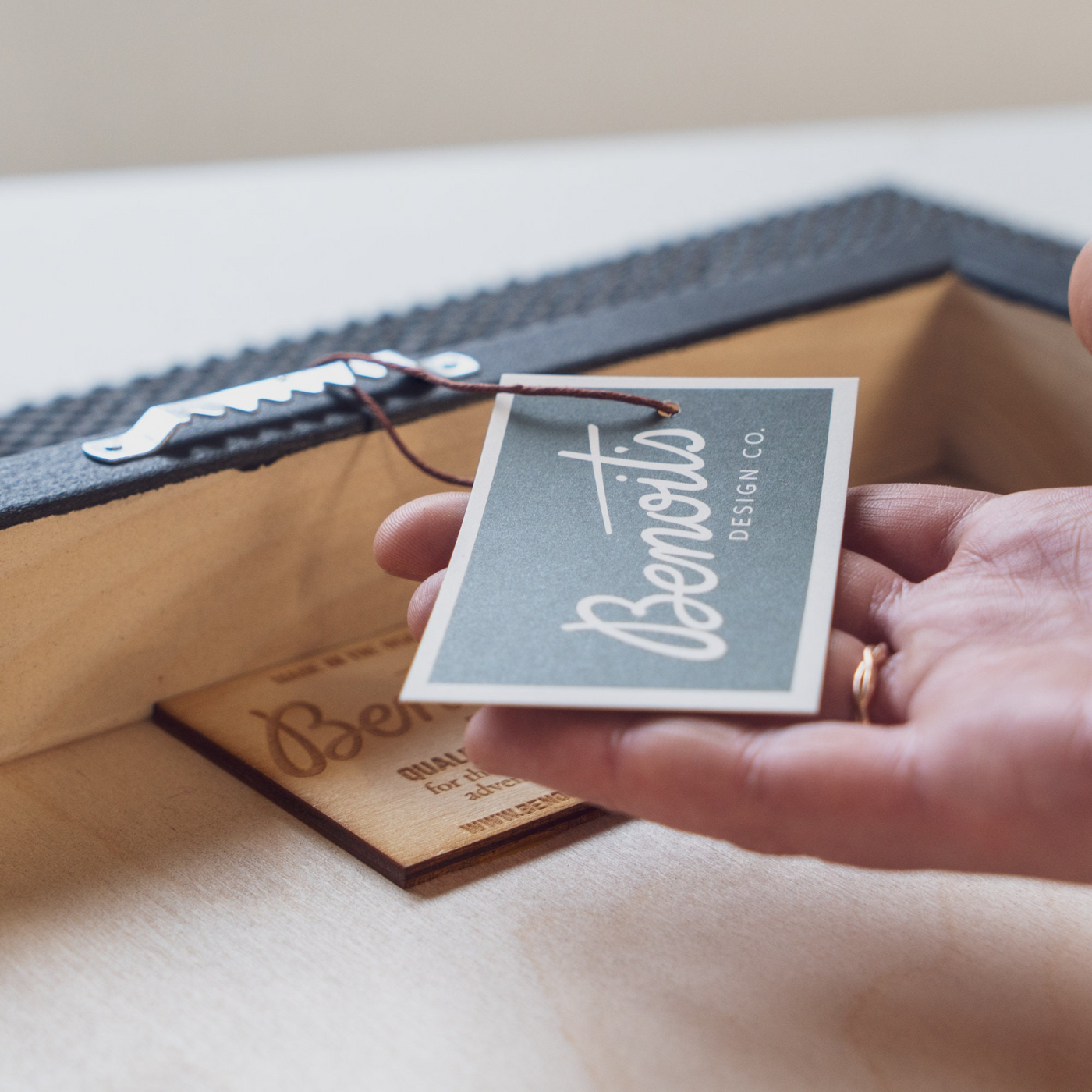 a person holding a business card in their hand