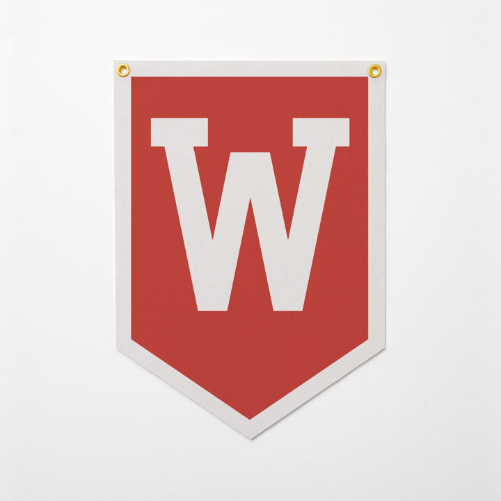 A red banner with a large white letter &amp;quot;W&amp;quot; on it.