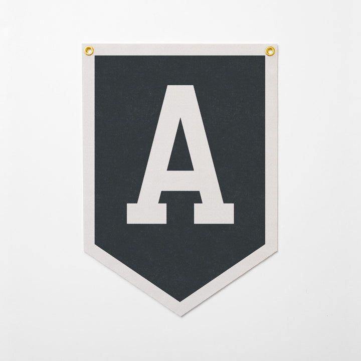 A black and white banner with a large white letter &amp;quot;A&amp;quot; displayed prominently in the center.