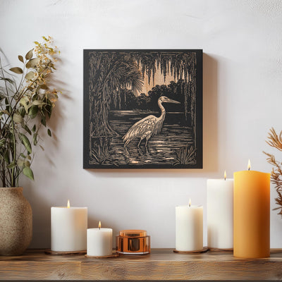 a picture of a bird on a wall next to candles