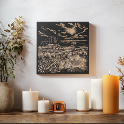 a table topped with candles and a painting on the wall