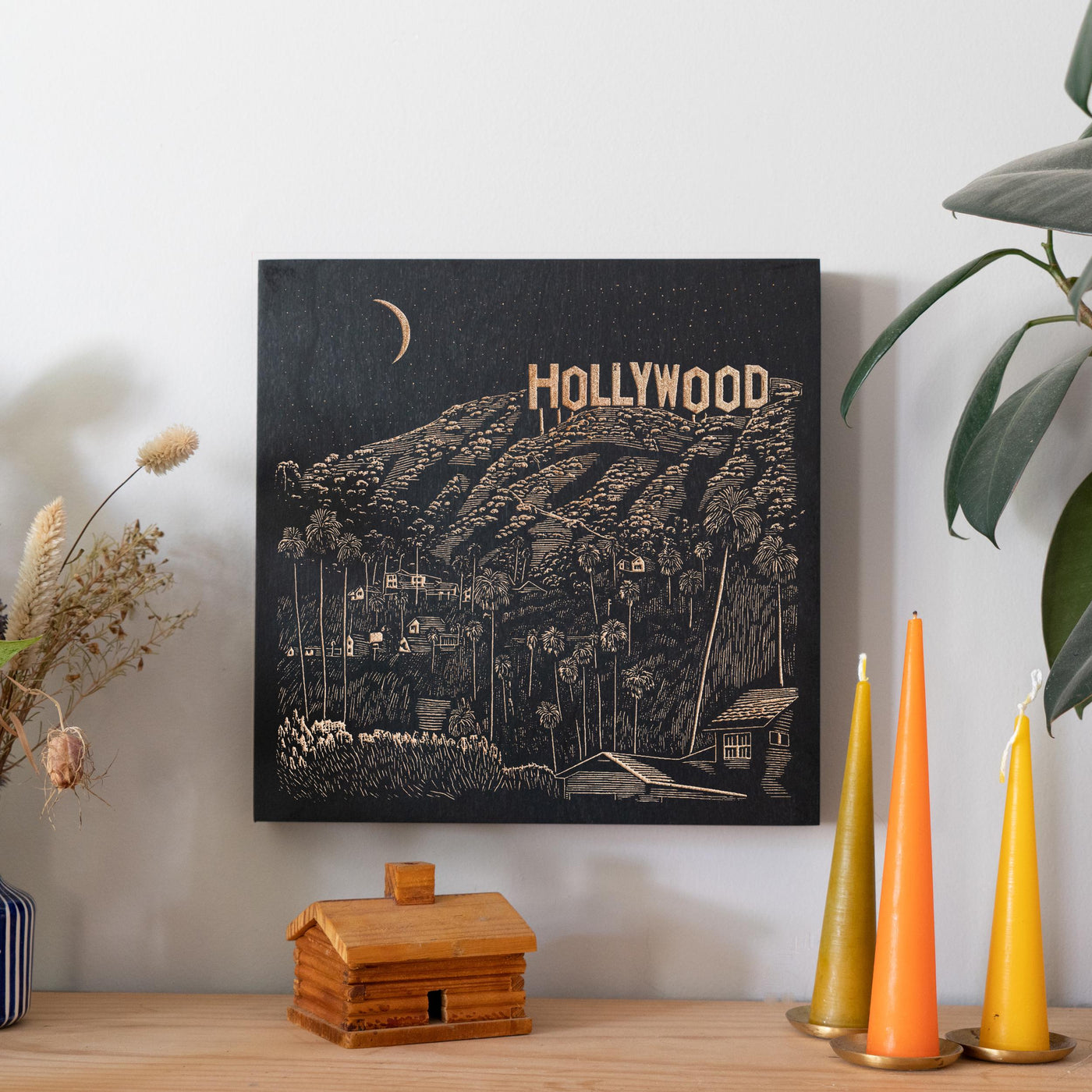 a picture of hollywood on a wall above a table