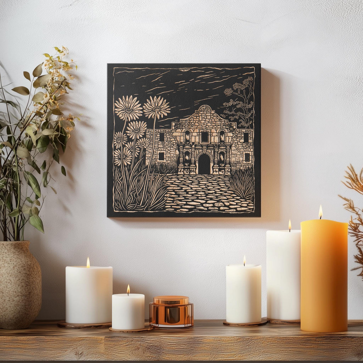 a table topped with candles and a painting on the wall