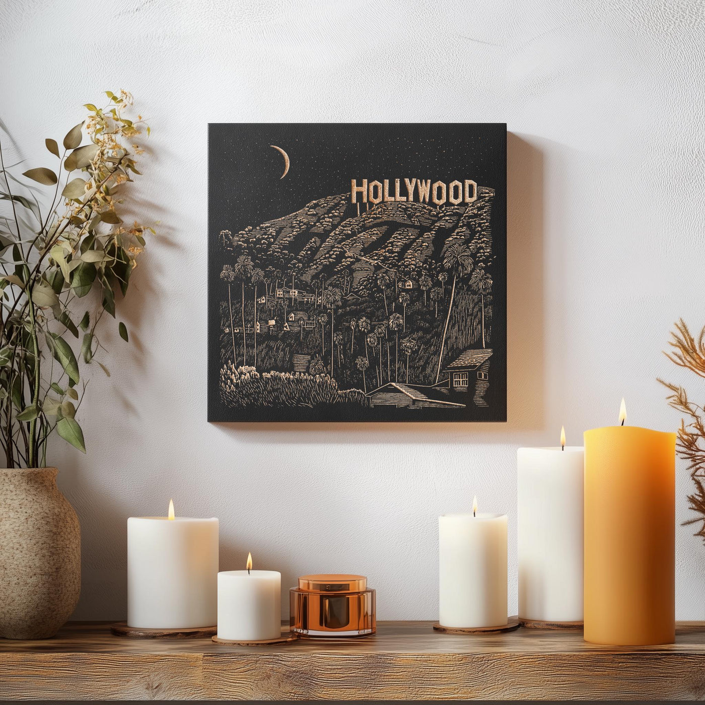 a wooden table topped with candles and a painting