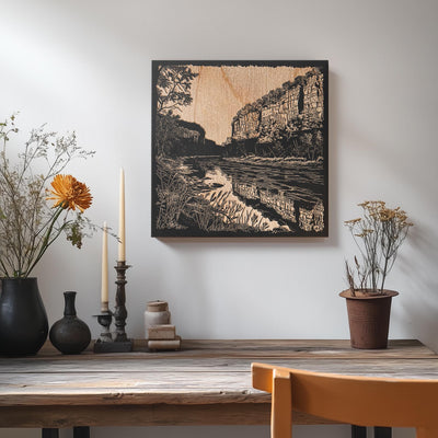 a table with vases of flowers and a painting on the wall