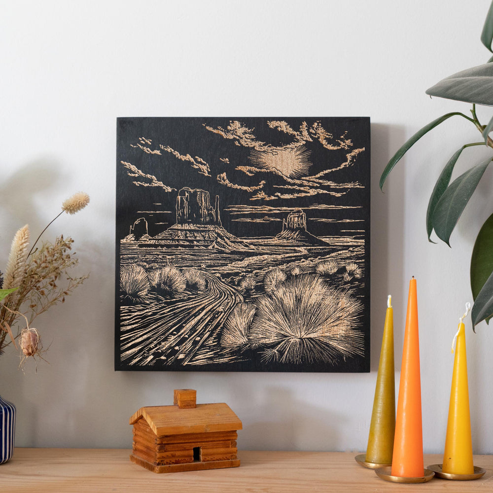 a picture of a desert landscape on a wall