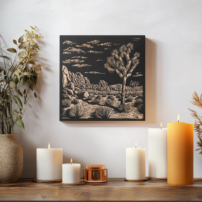 a table topped with candles and a painting on the wall