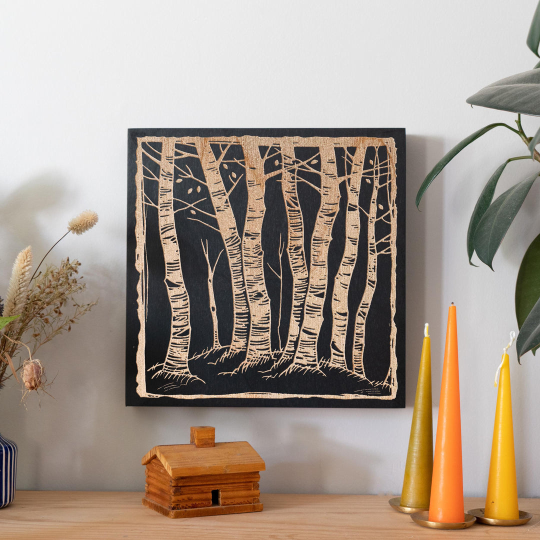 a picture of a group of trees on a wall