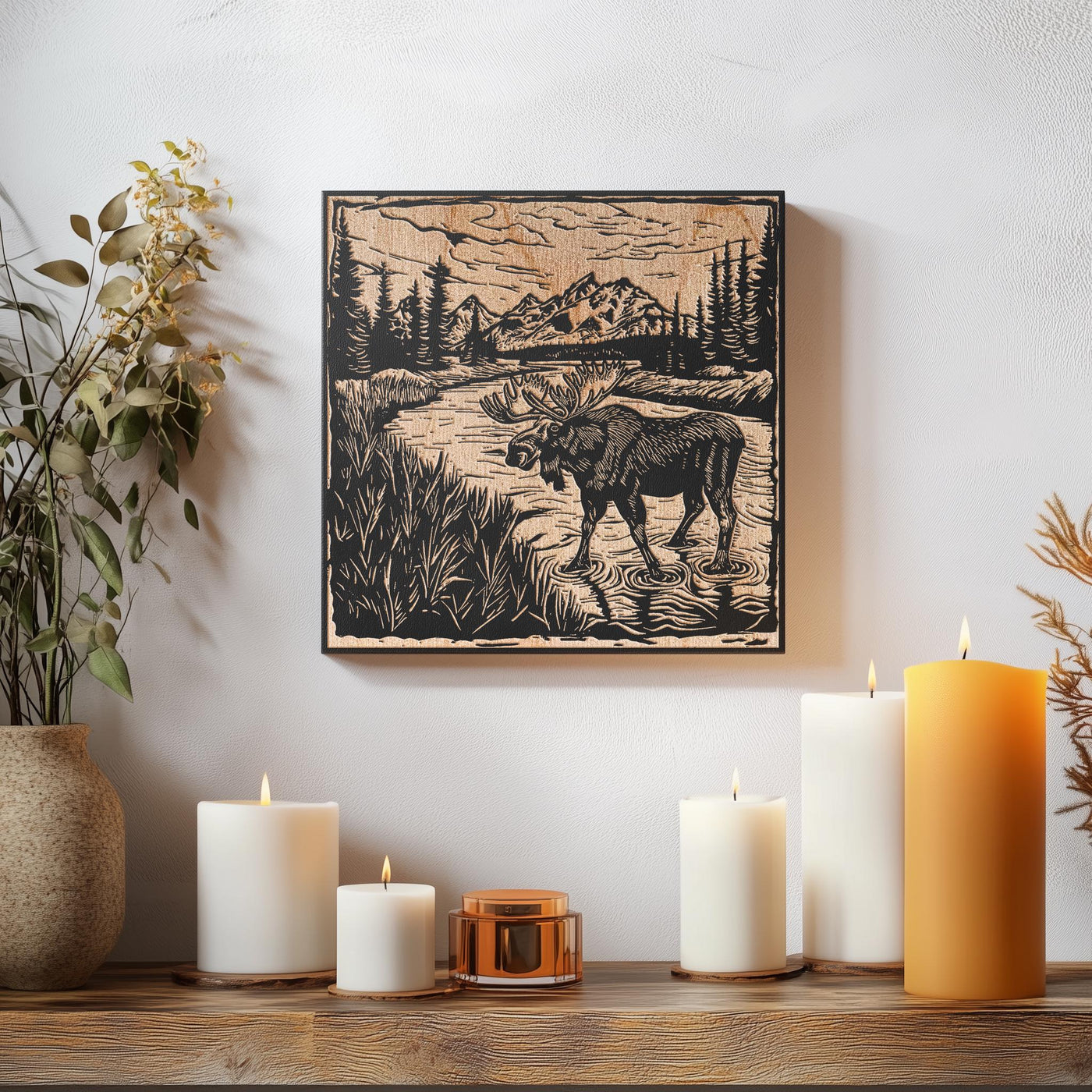 a picture of a cow on a wall next to candles