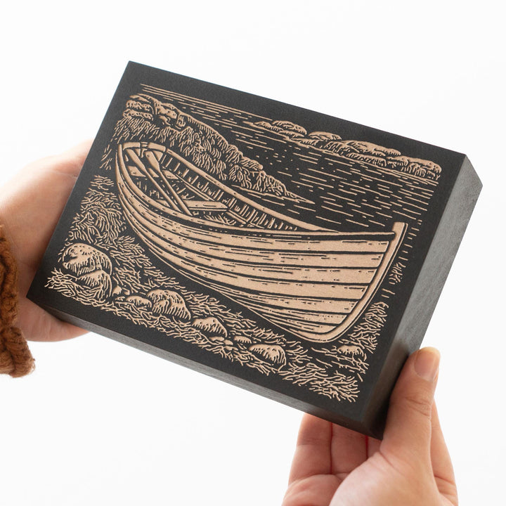 Wooden Dory on Rocky Coast Engraved Wood Panel
