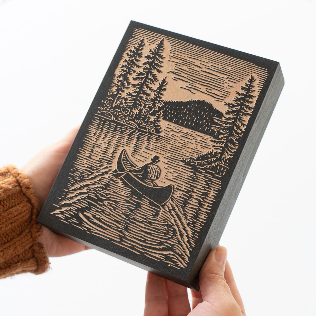 Canoer on Serene Lake Engraved Wood Panel