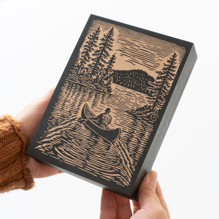 Canoer on Serene Lake Engraved Wood Panel