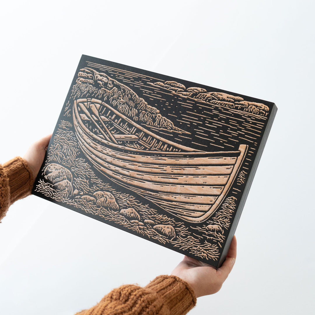 Wooden Dory on Rocky Coast Engraved Wood Panel