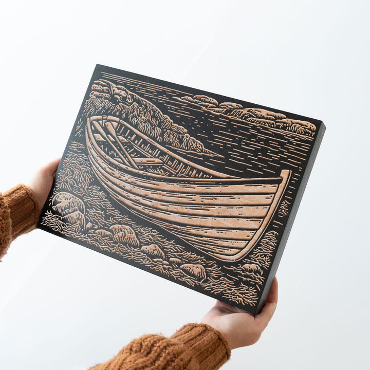 Wooden Dory on Rocky Coast Engraved Wood Panel